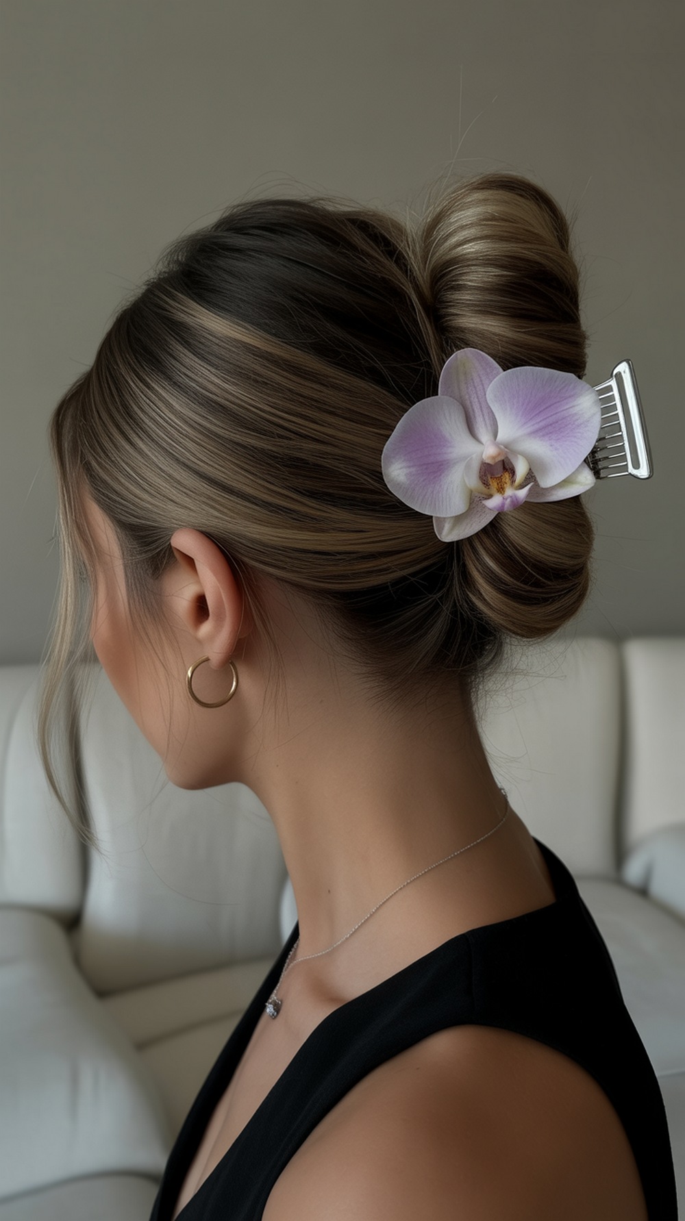 Sleek Bun with Orchid Clip Hairstyle