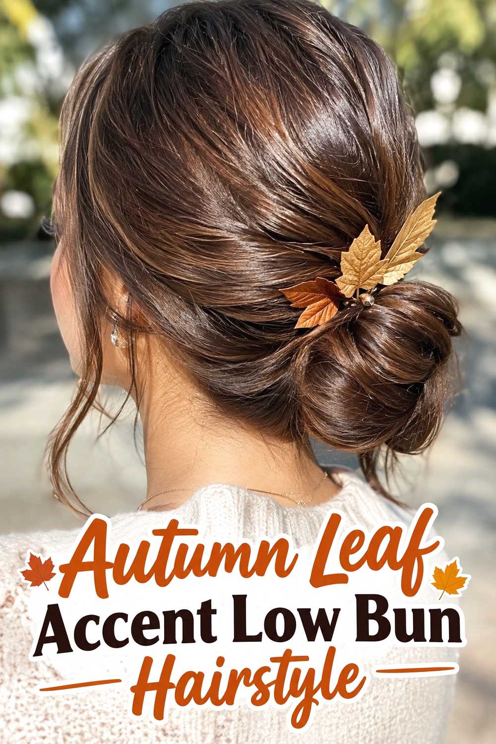 12. Autumn Leaf Accent Low Bun Hairstyle