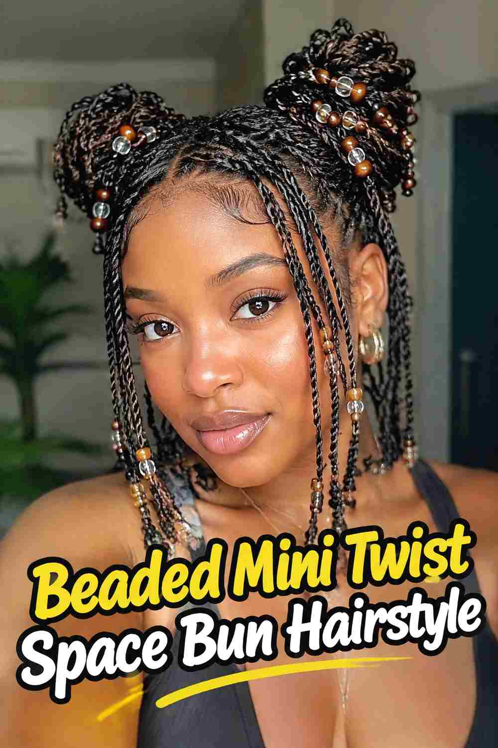 8. Beaded Mini Twist Space Bun Hairstyle