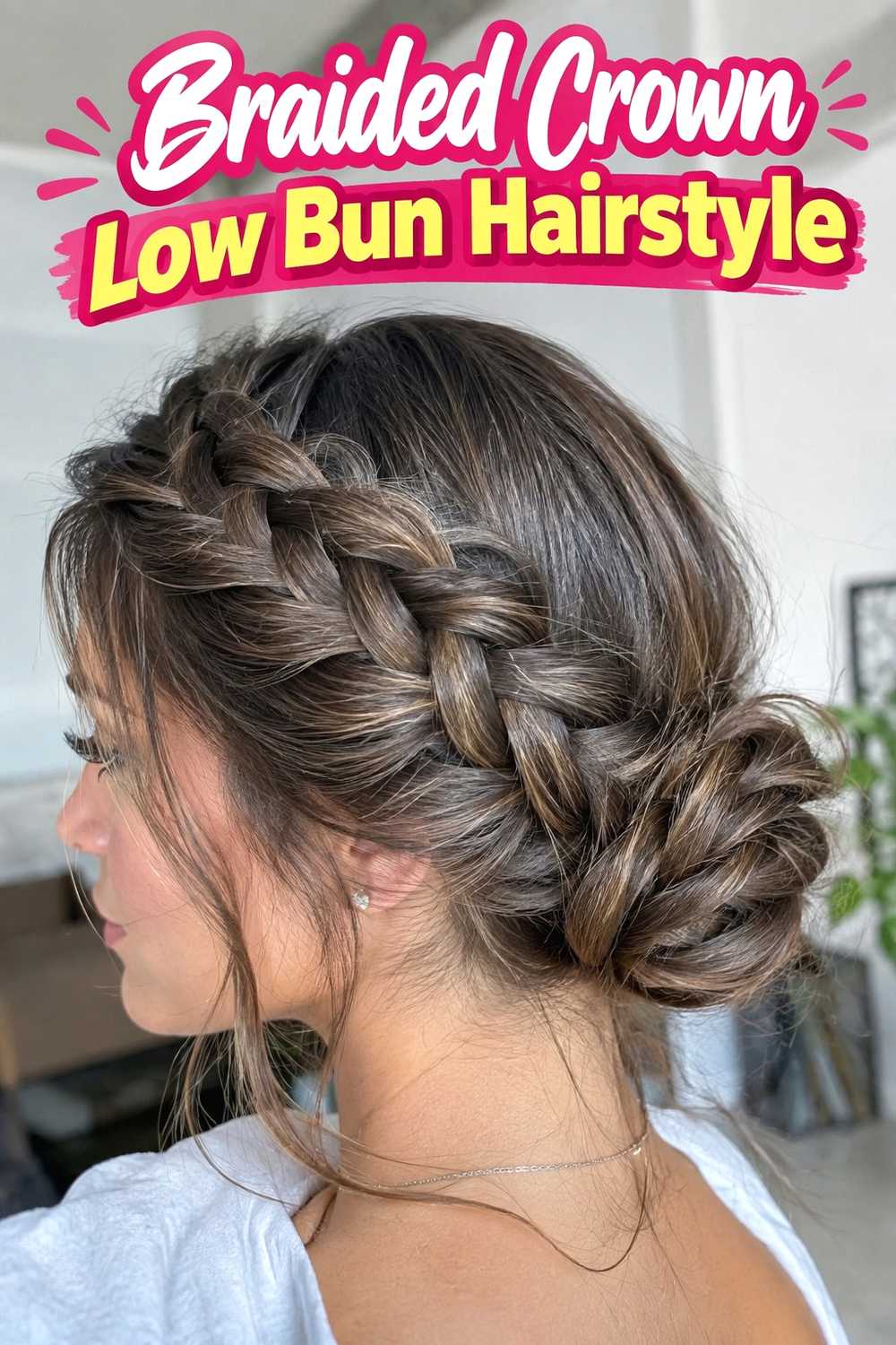 3. Braided Crown Low Bun Hairstyle