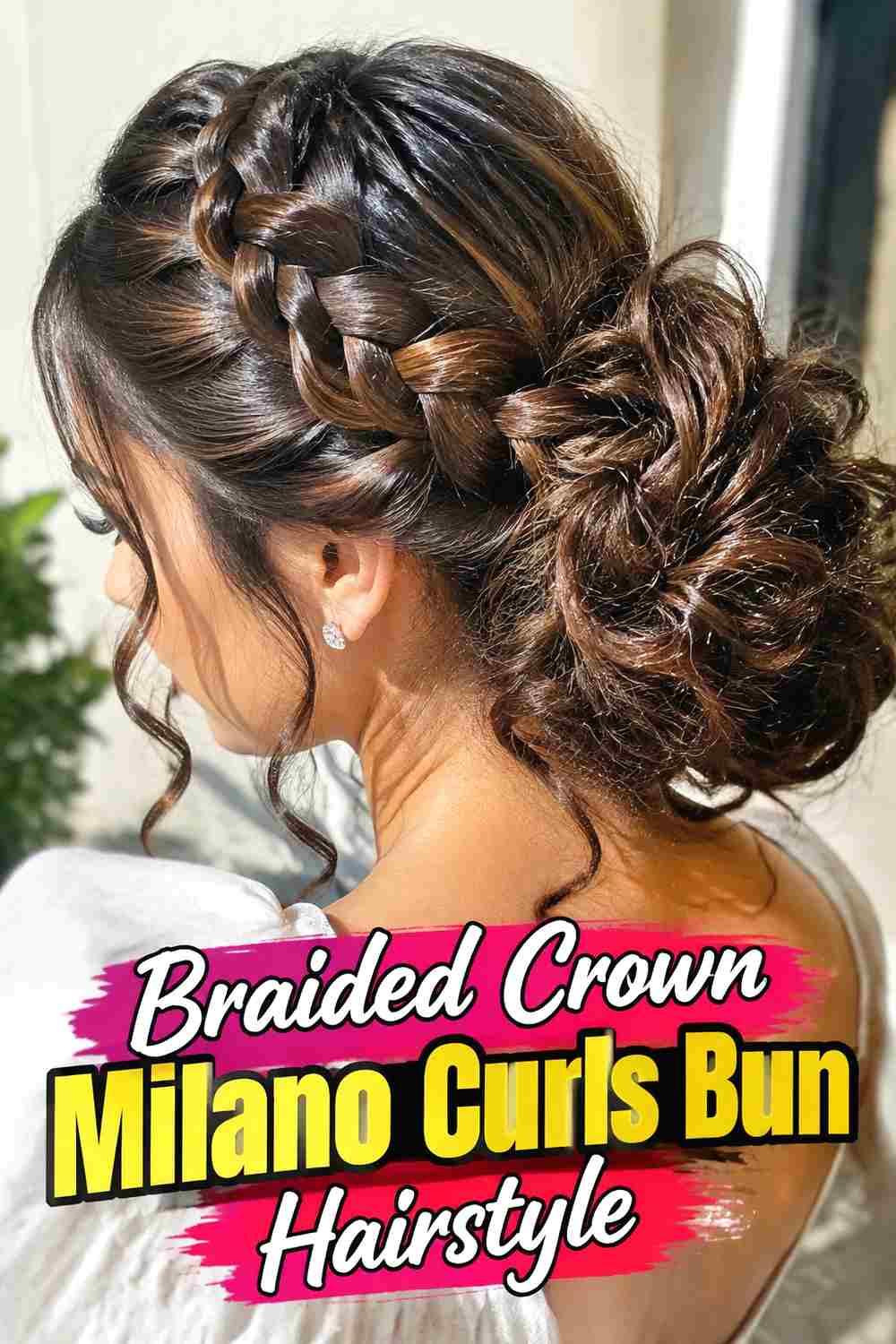 9. Braided Crown Milano Curls Bun Hairstyle