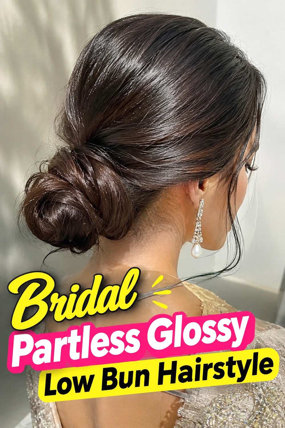 17. Bridal Partless Glossy Low Bun Hairstyle