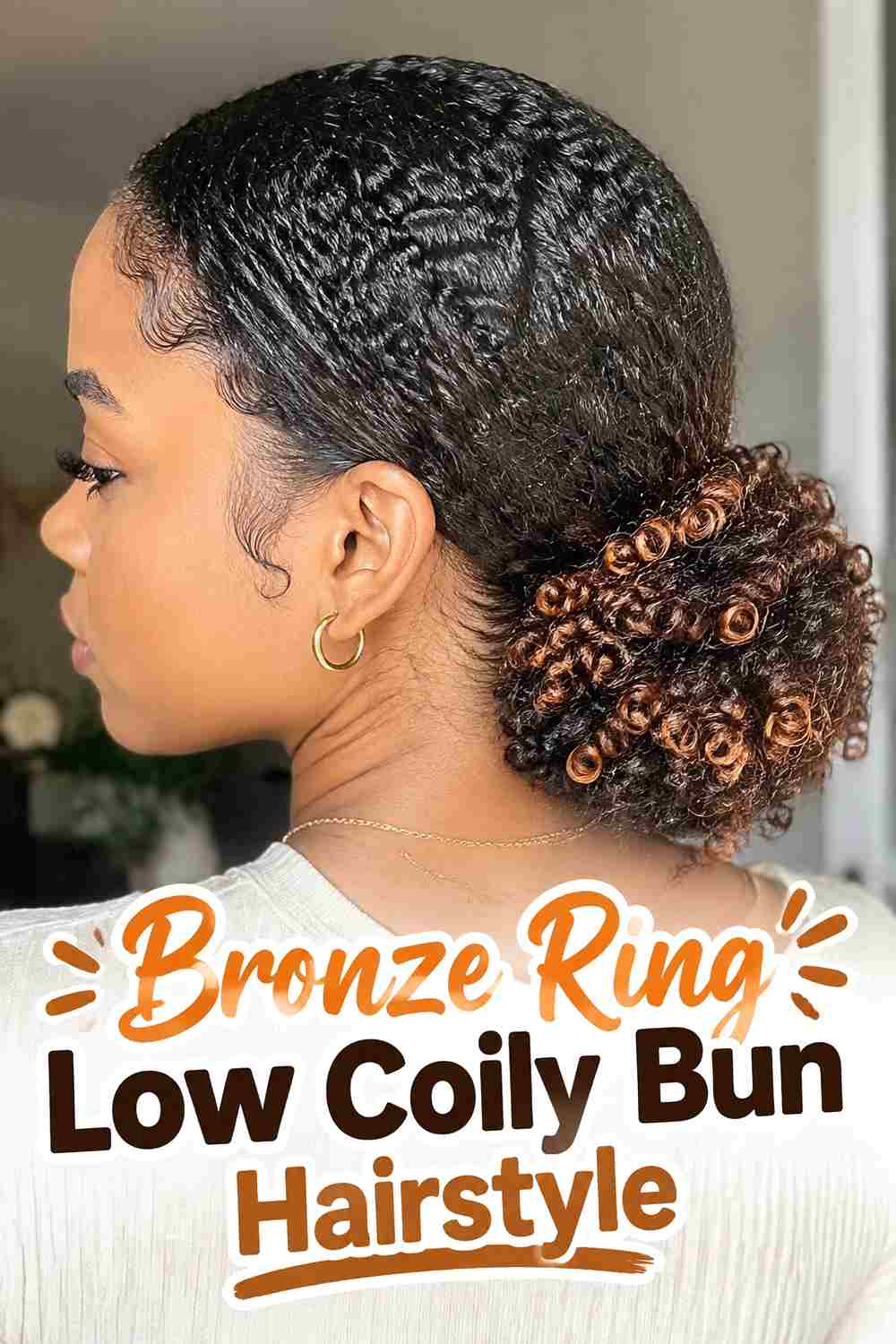 12. Bronze Ring Low Coily Bun Hairstyle