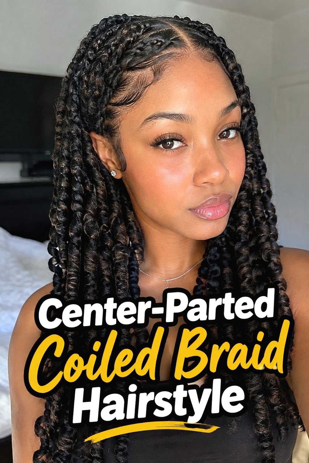 4. Center Parted Coiled Braid Hairstyle