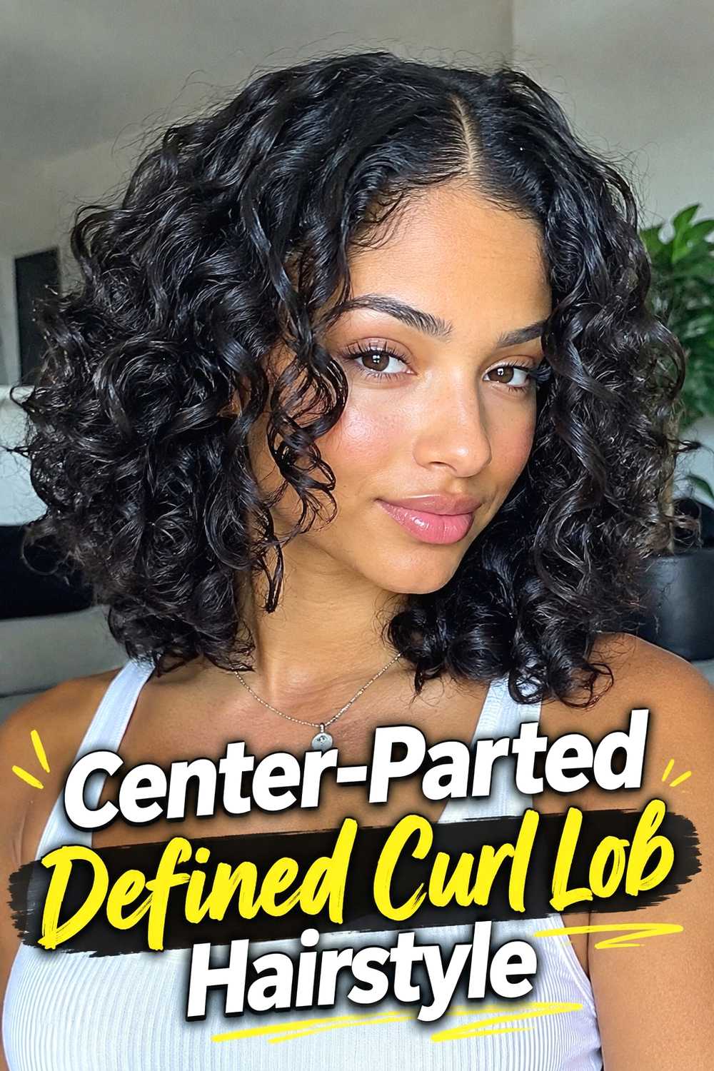6. Center Parted Defined Curl Lob Hairstyle