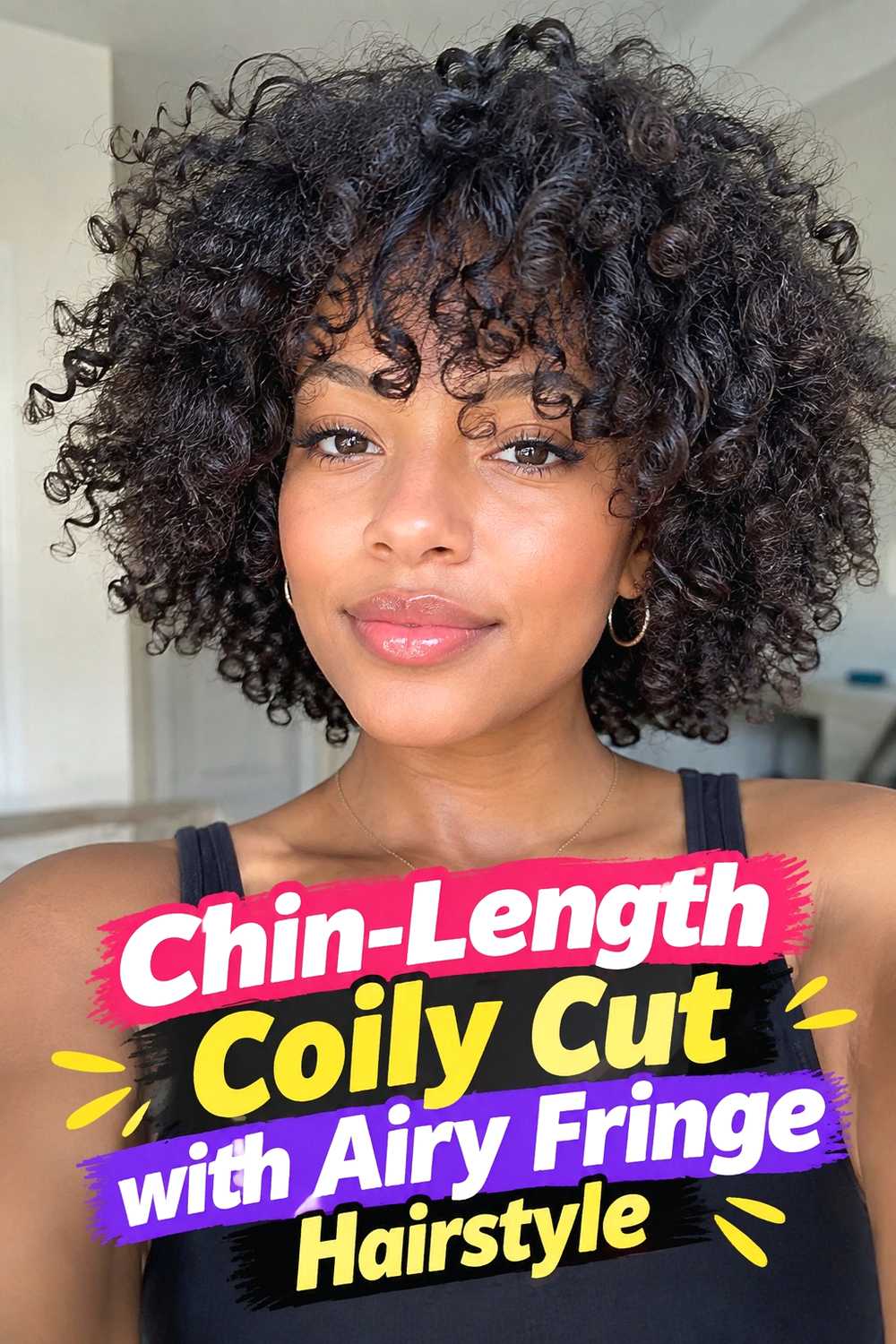 12. Chin Length Coily Cut With Airy Fringe Hairstyle