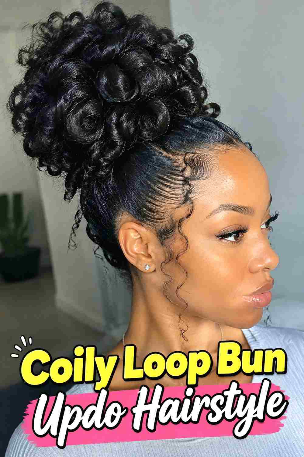 14. Coily Loop Bun Updo Hairstyle