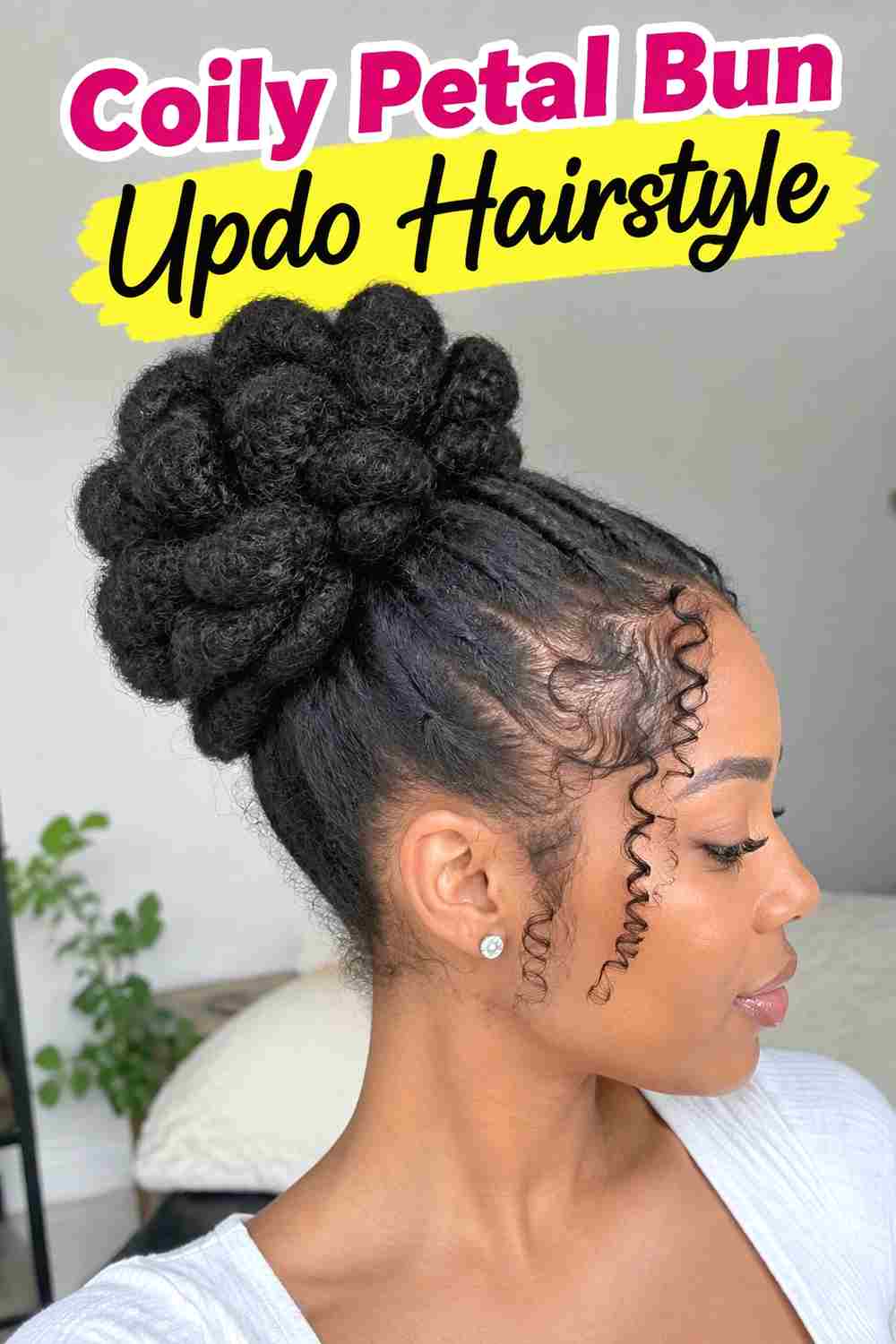 4. Coily Petal Bun Updo Hairstyle