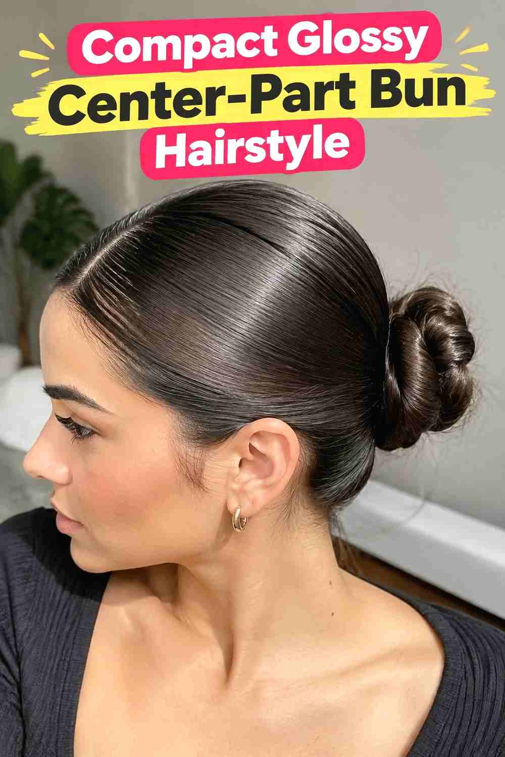 8. Compact Glossy Center Part Bun Hairstyle