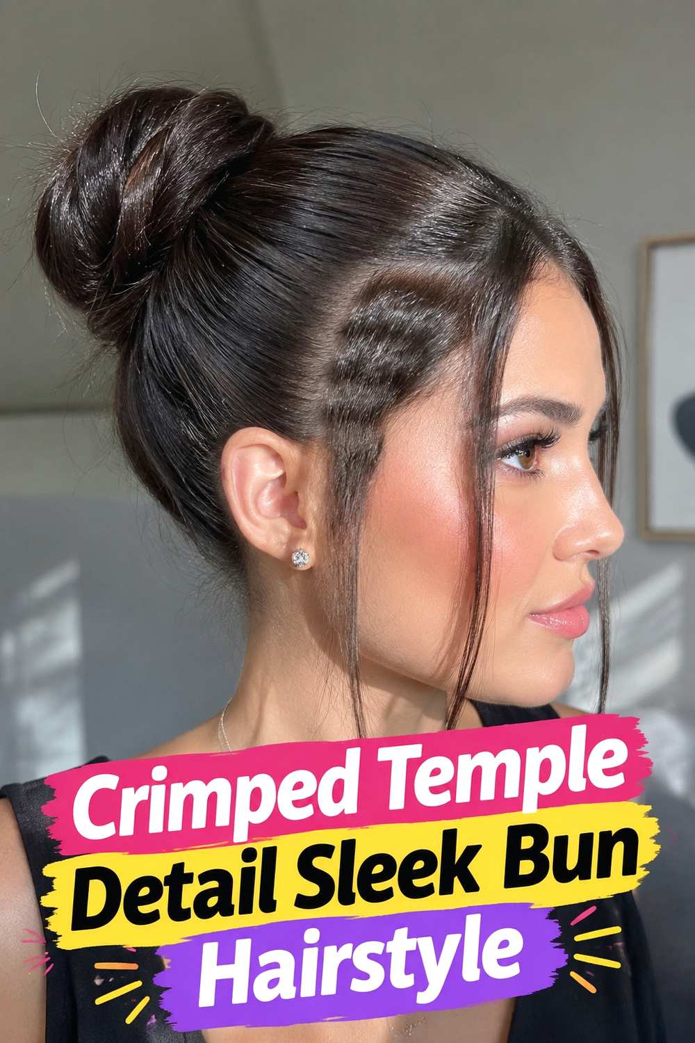 10. Crimped Temple Detail Sleek Bun Hairstyle