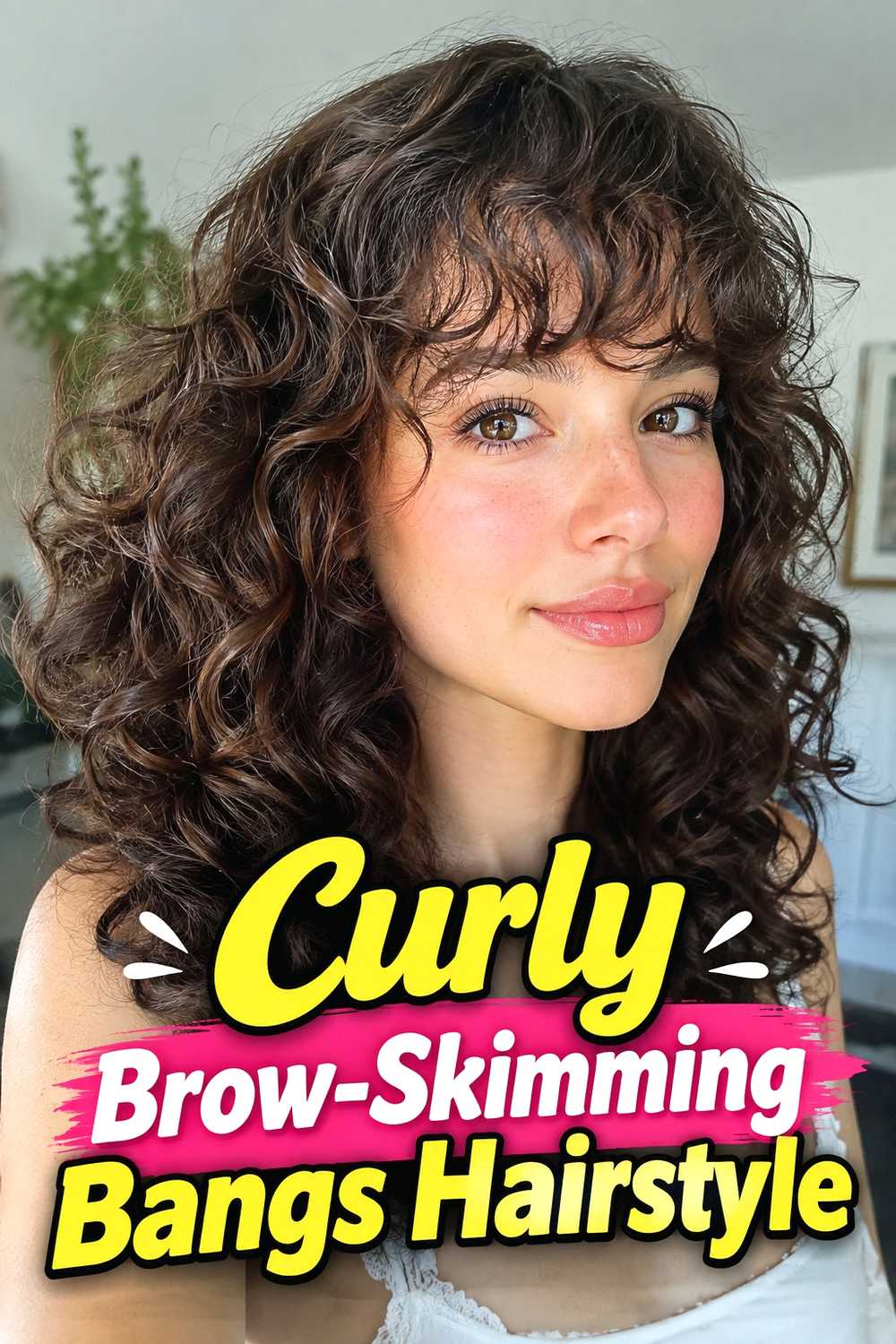 6. Curly Brow Skimming Bangs Hairstyle