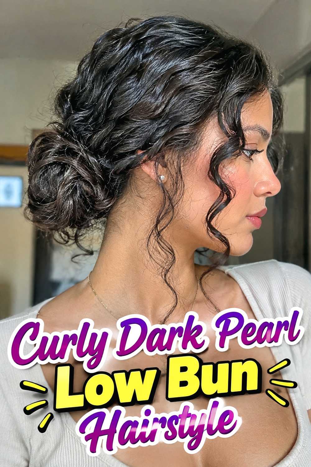 15. Curly Dark Pearl Low Bun Hairstyle