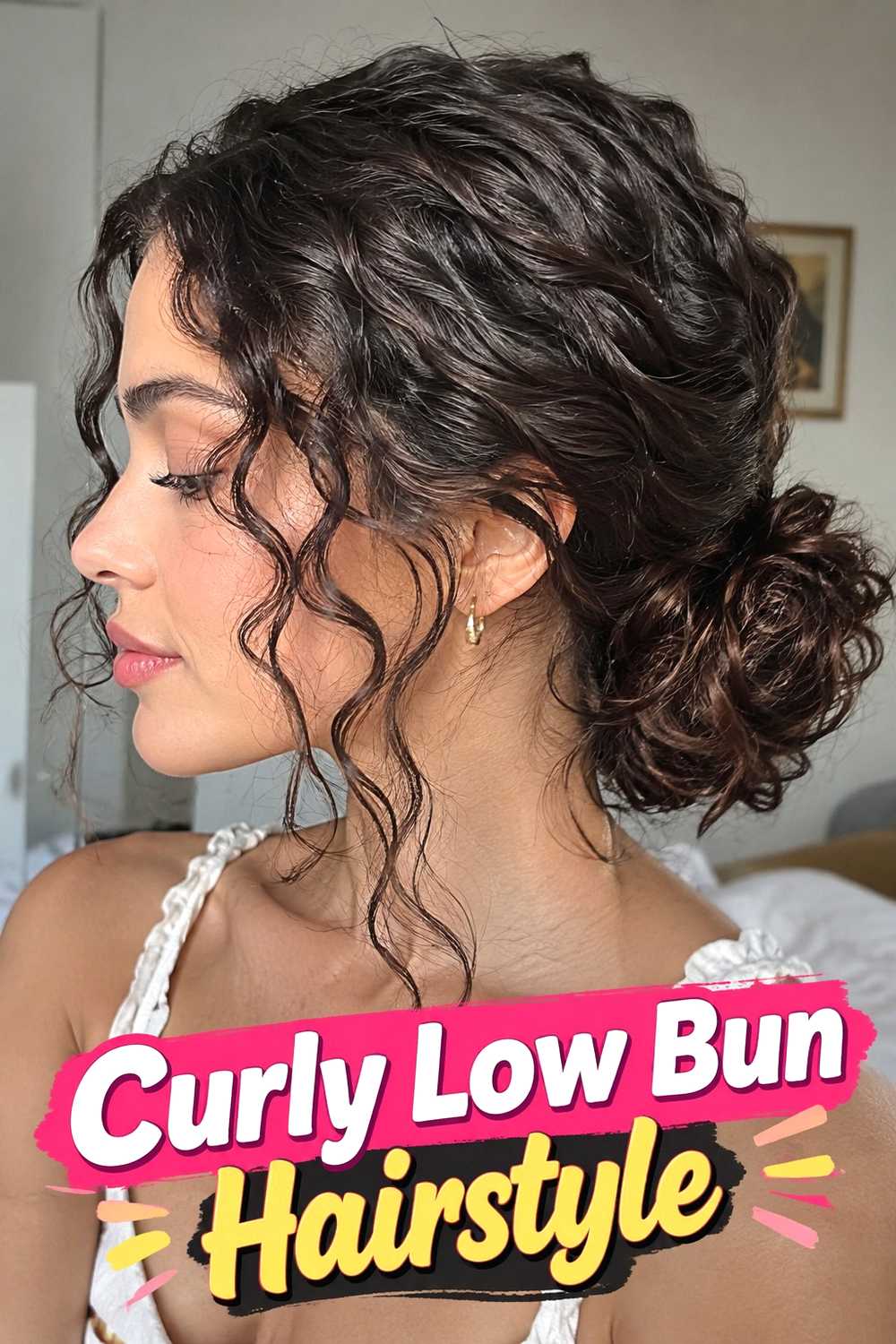 7. Curly Low Bun Hairstyle