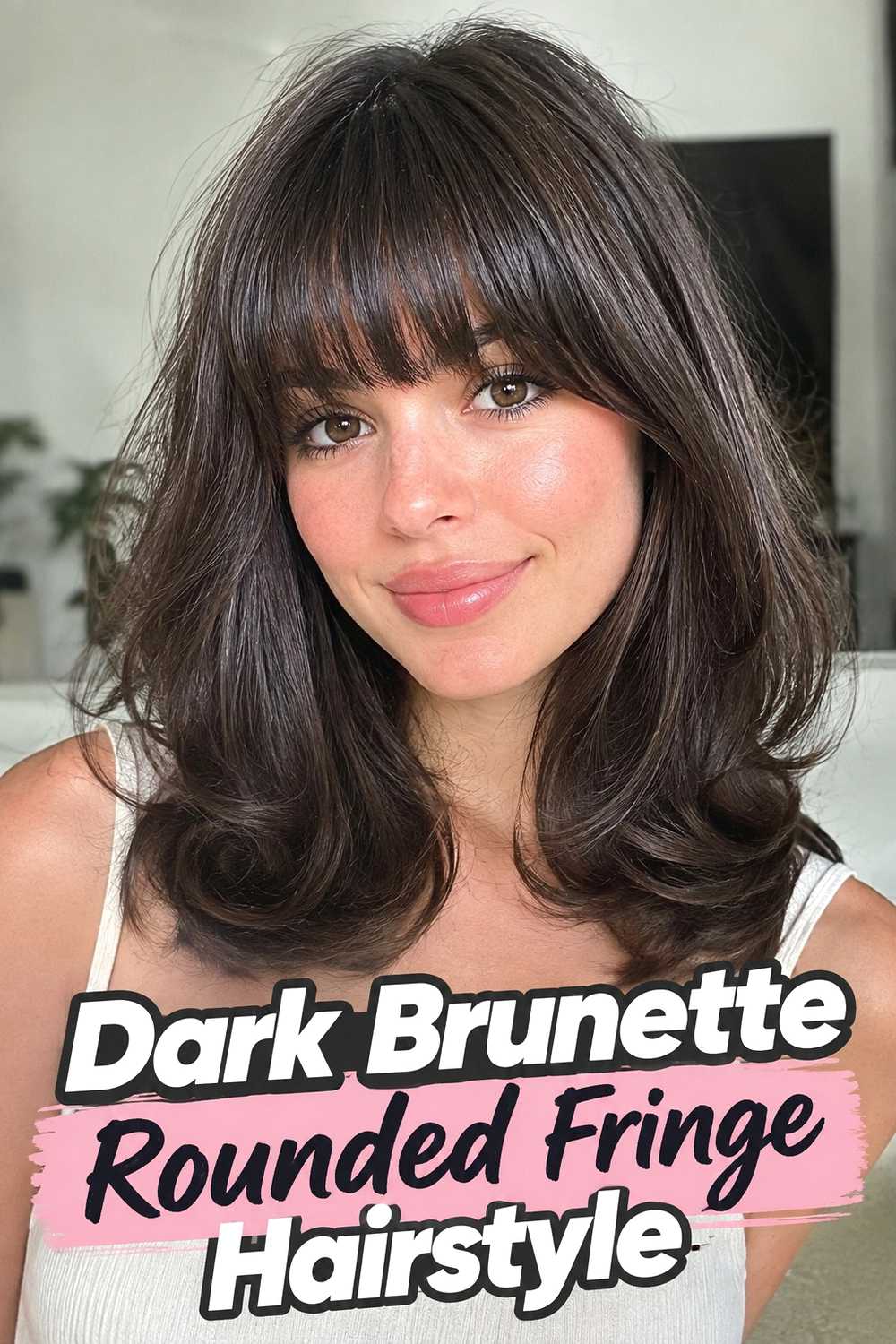 13. Dark Brunette Rounded Fringe Hairstyle