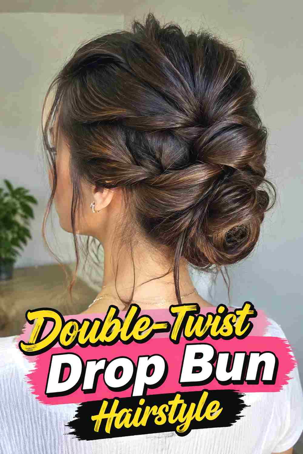 13. Double Twist Drop Bun Hairstyle