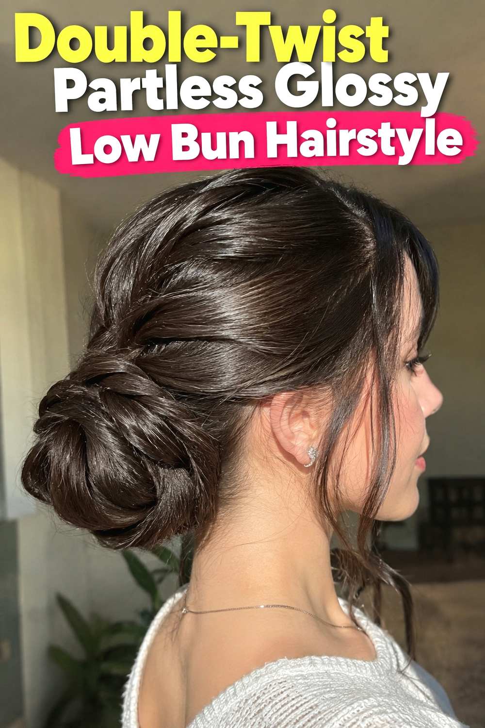 10. Double Twist Partless Glossy Low Bun Hairstyle