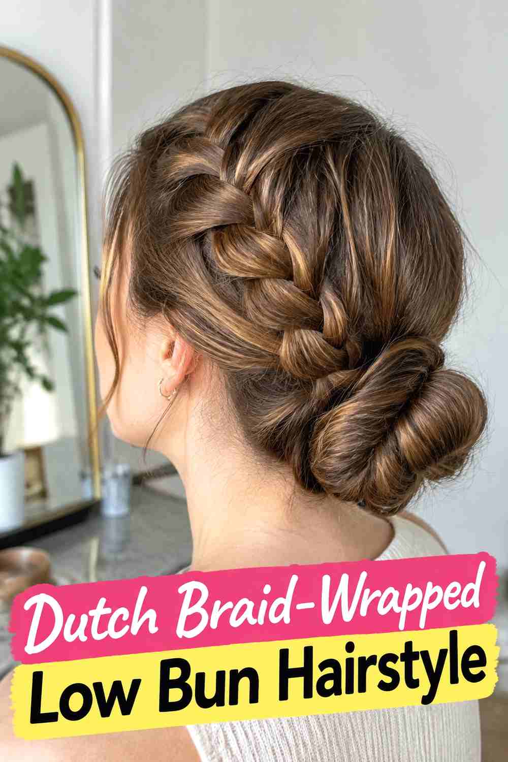 4. Dutch Braid Wrapped Low Bun Hairstyle