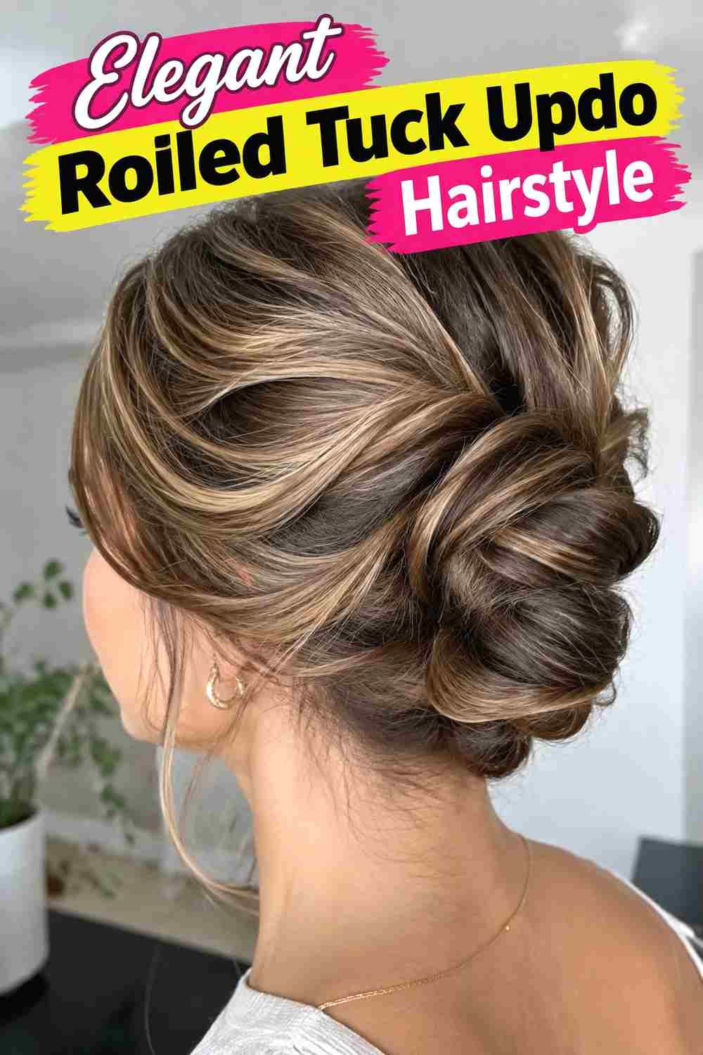 12. Elegant Rolled Tuck Updo Hairstyle