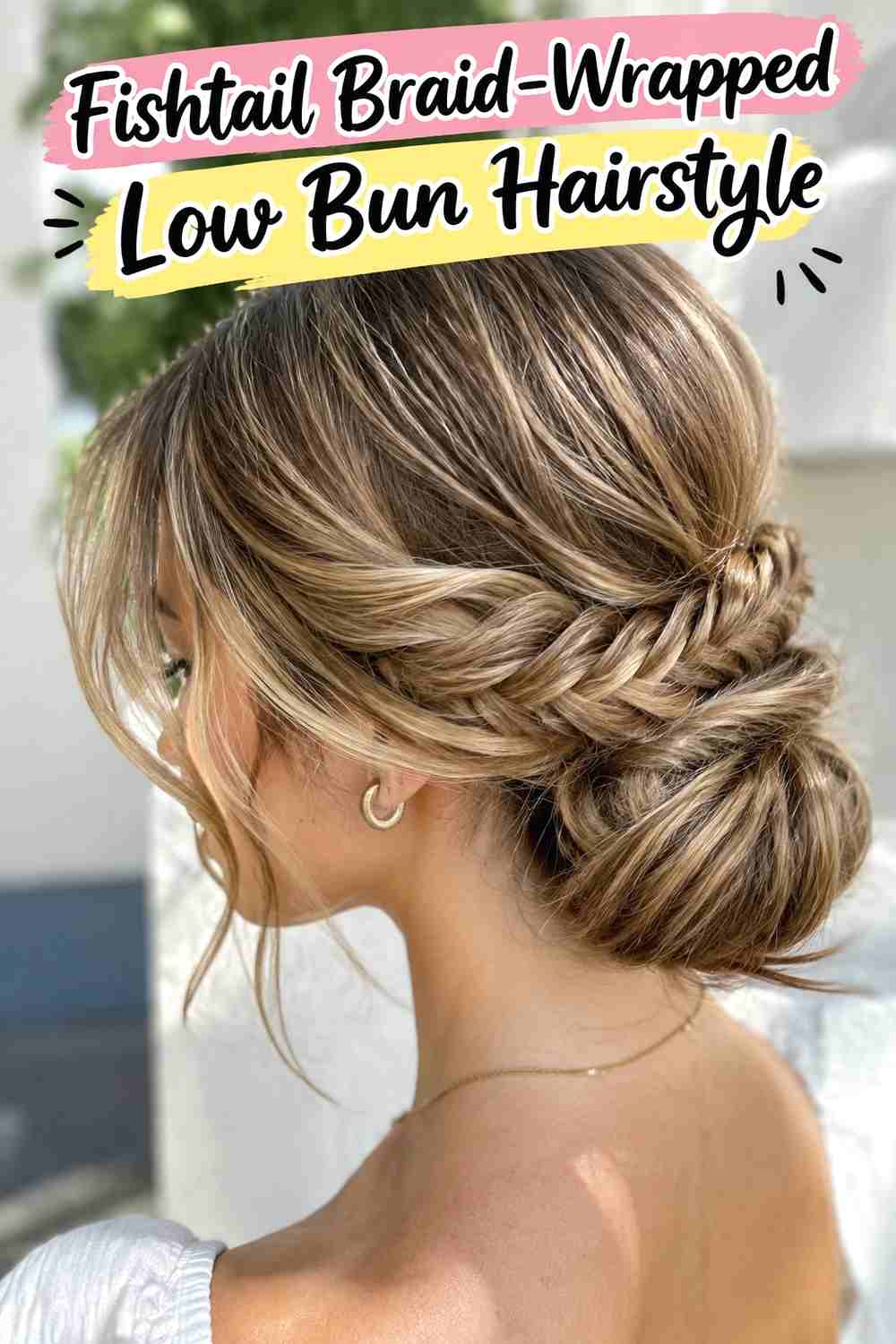 6. Fishtail Braid Wrapped Low Bun Hairstyle