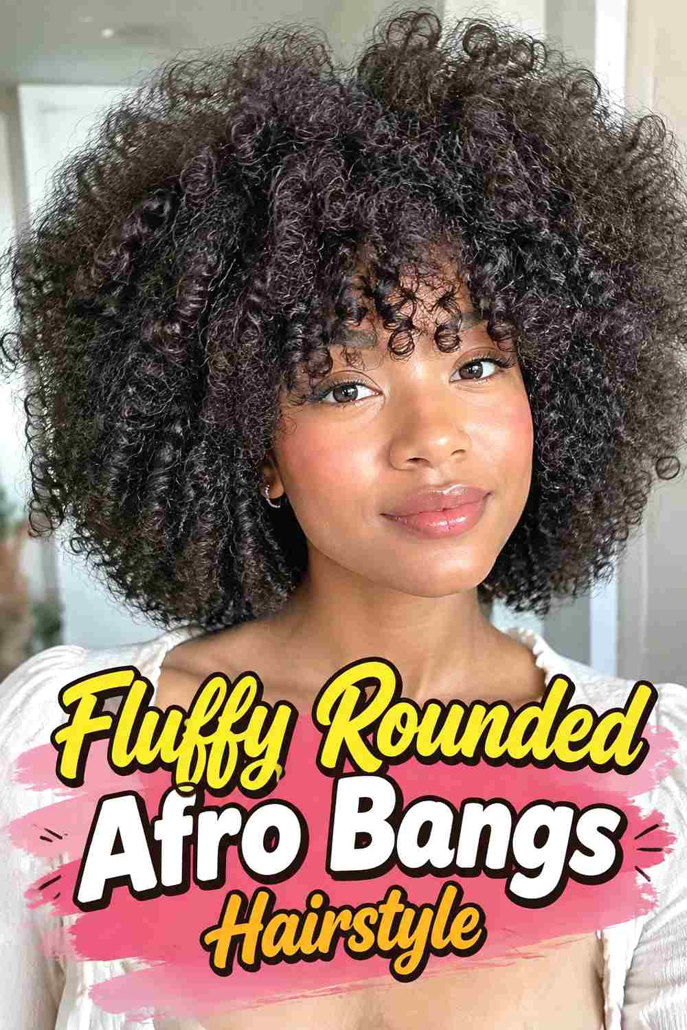 6. Fluffy Rounded Afro Bangs Hairstyle