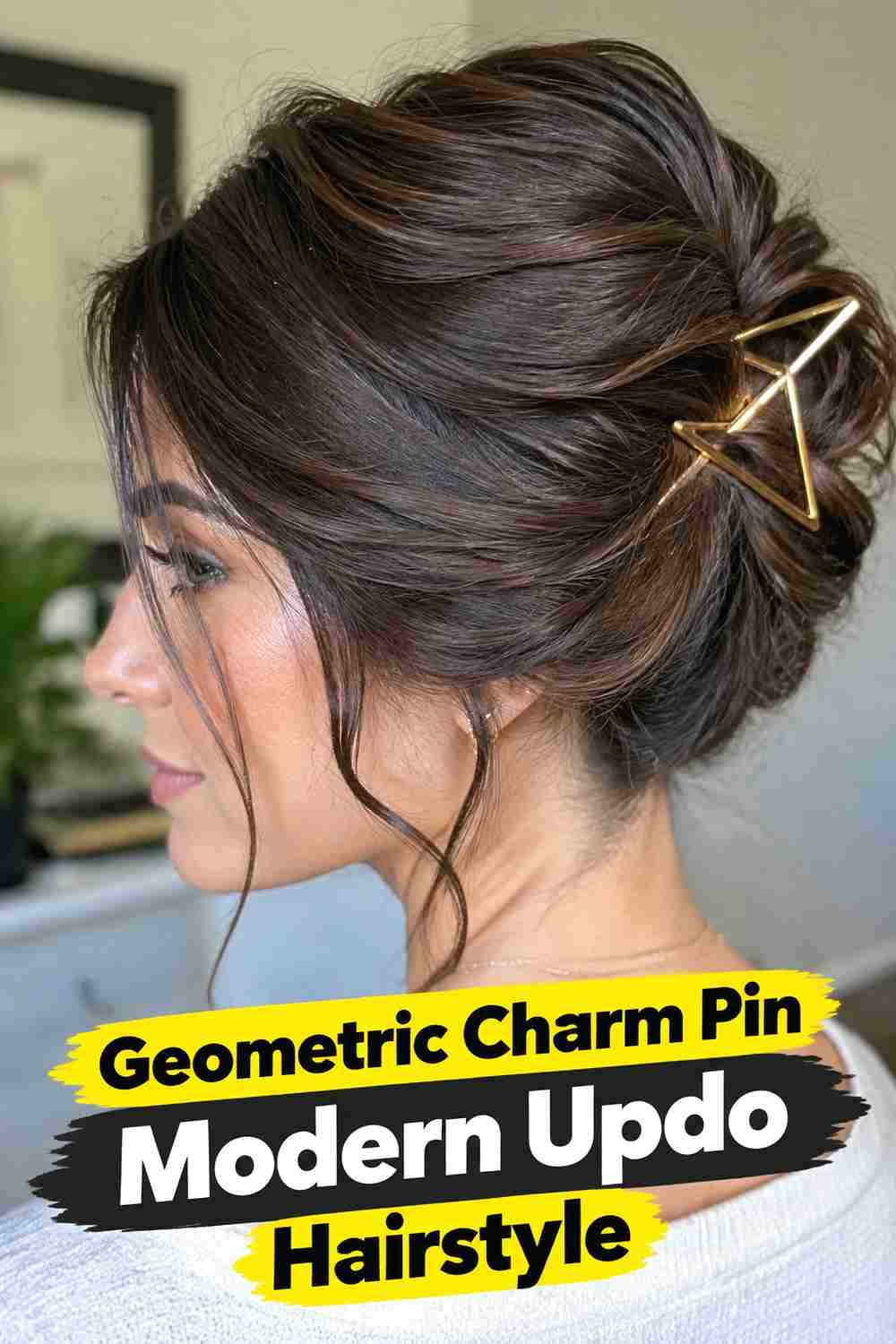 20. Geometric Charm Pin Modern Updo Hairstyle
