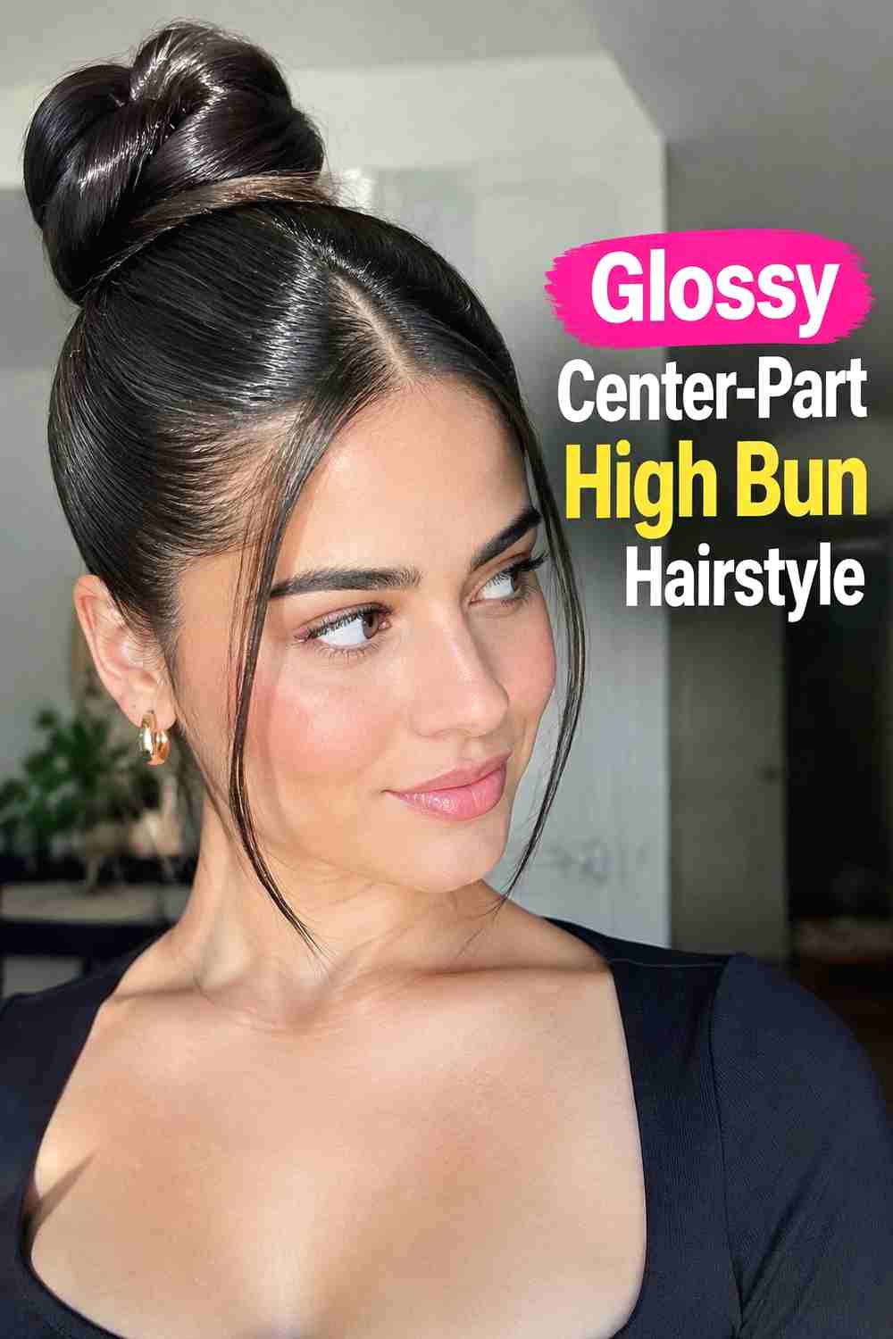 7. Glossy Center Part High Bun Hairstyle