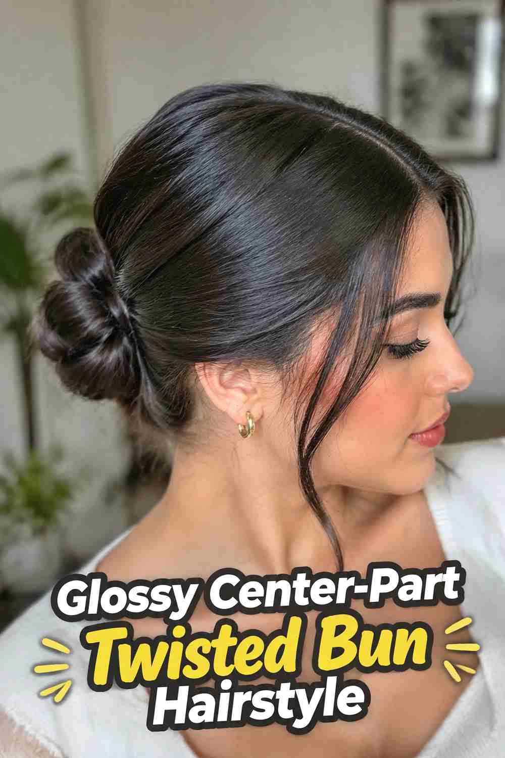4. Glossy Center Part Twisted Bun Hairstyle