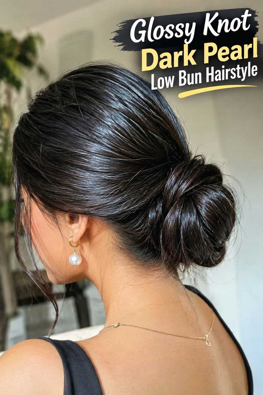 3. Glossy Knot Dark Pearl Low Bun Hairstyle