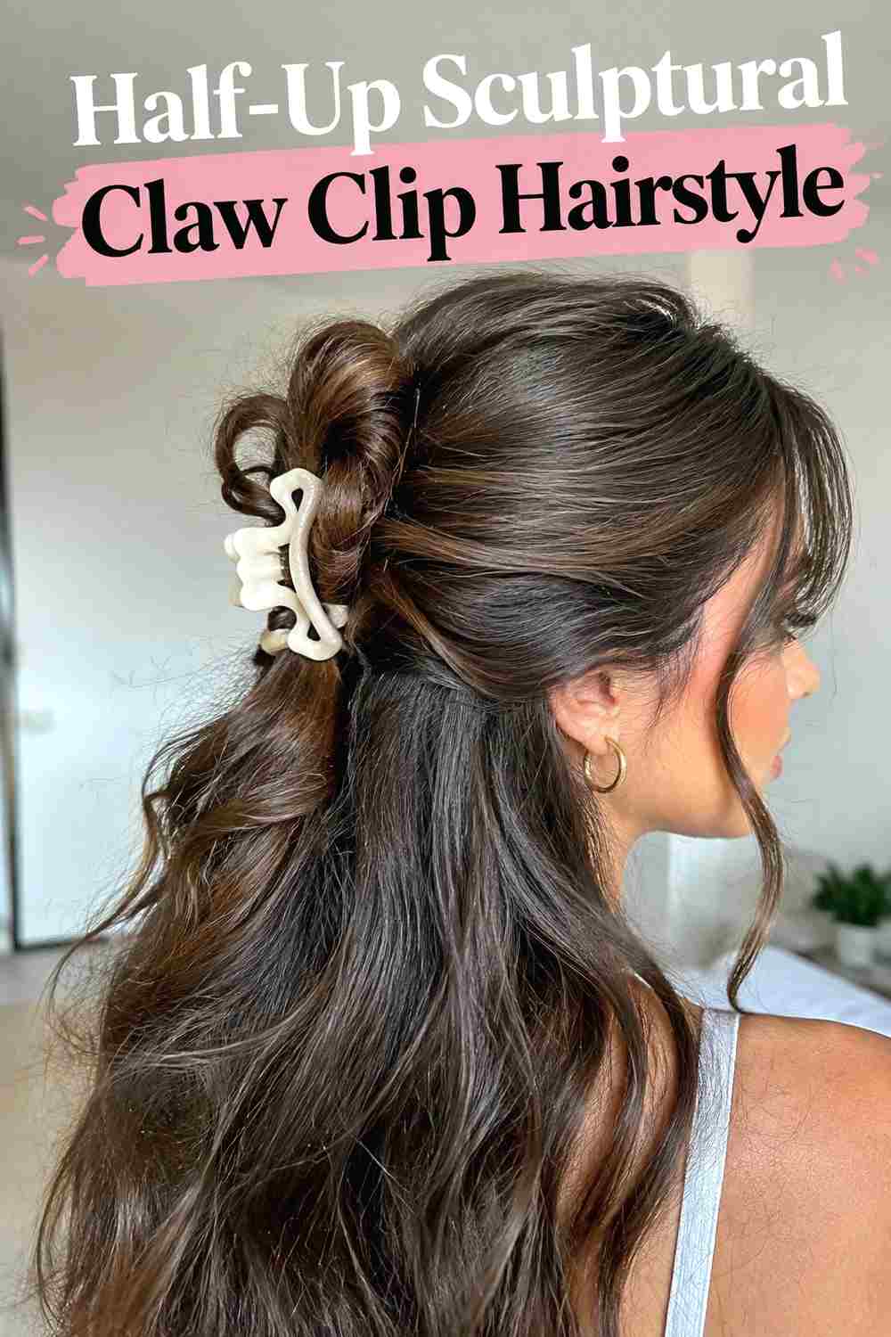 13. Half Up Sculptural Claw Clip Hairstyle