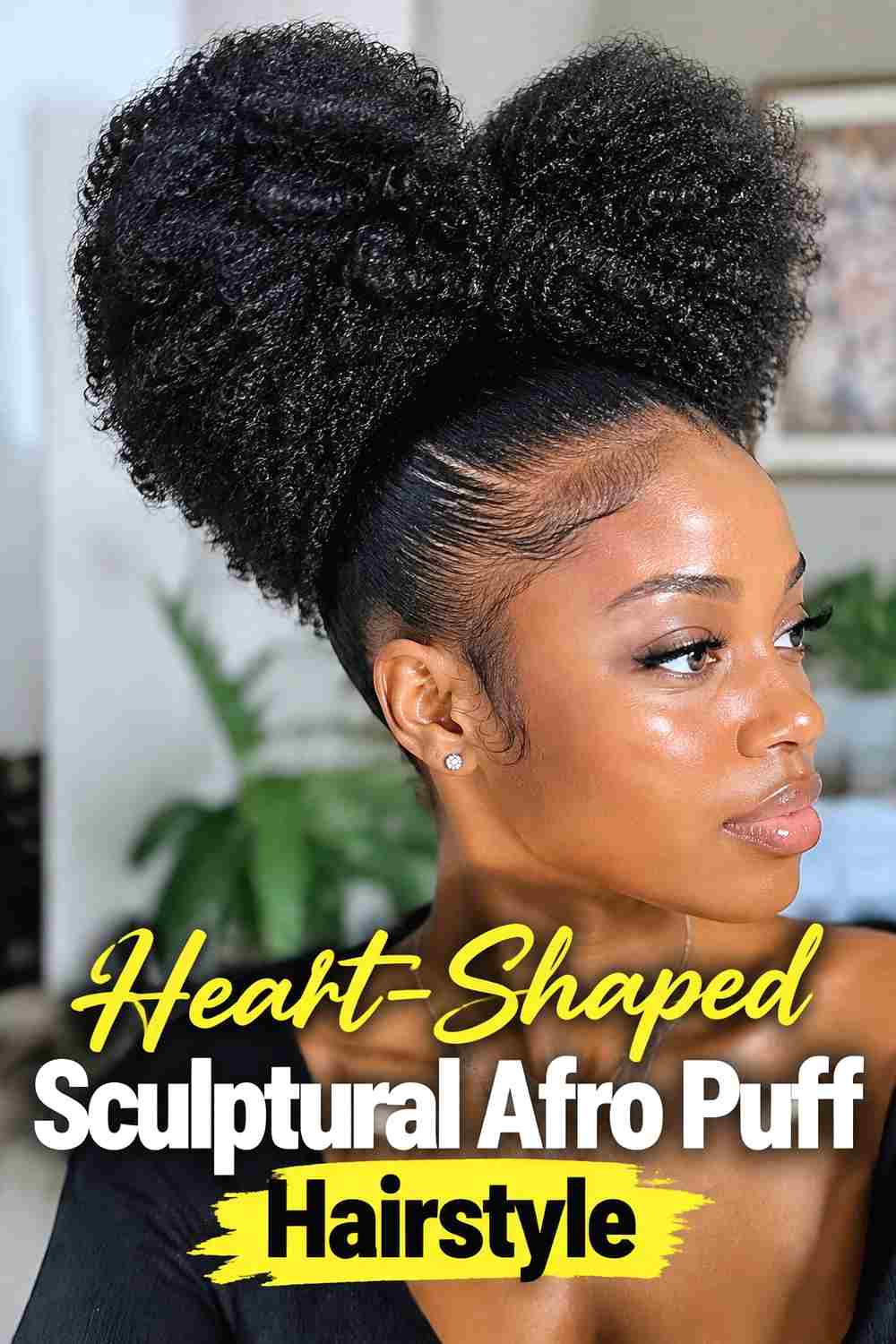 9. Heart Shaped Sculptural Afro Puff Hairstyle