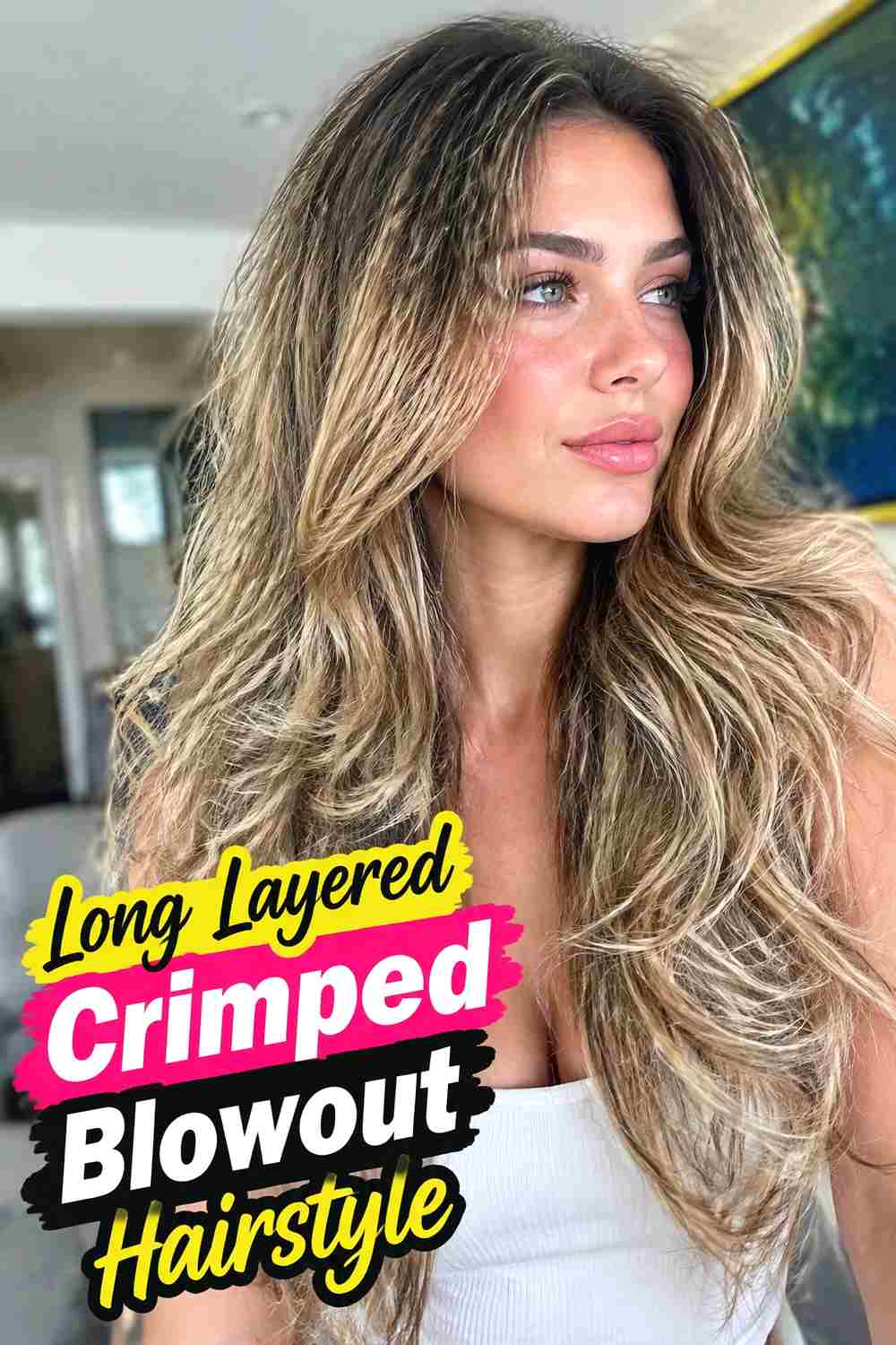 3. Long Layered Crimped Blowout Hairstyle