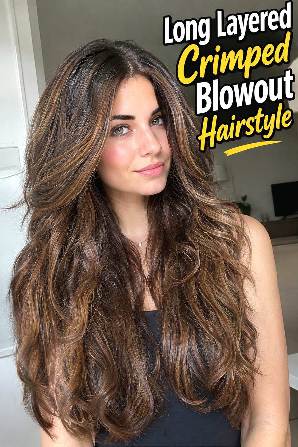 2. Long Layered Crimped Blowout Hairstyle