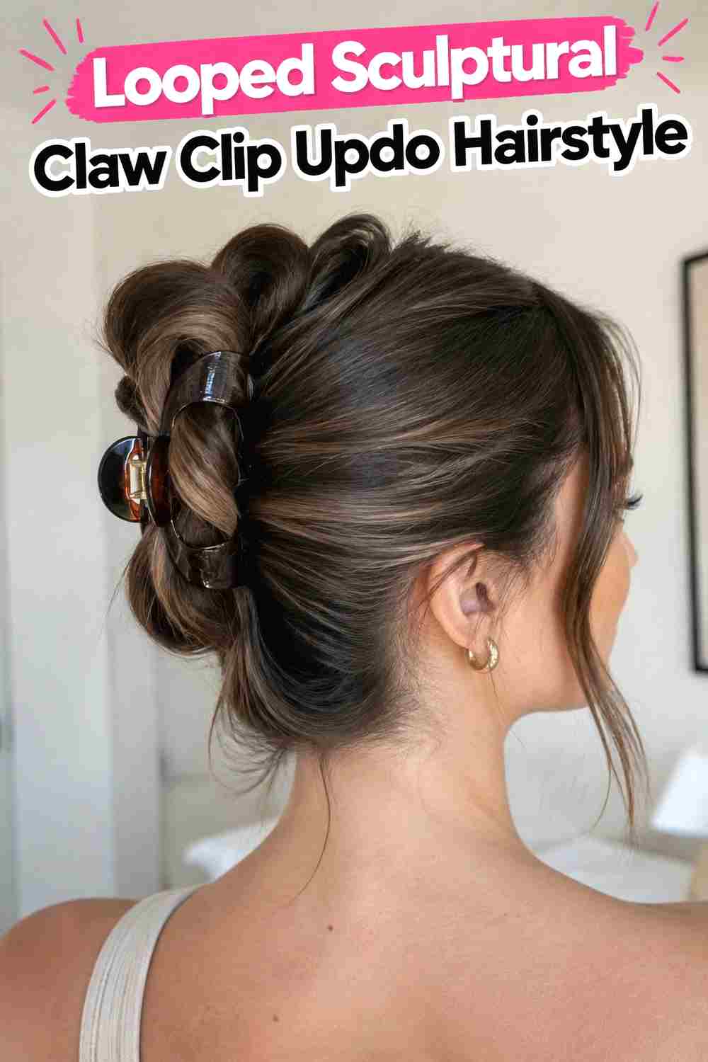 2. Looped Sculptural Claw Clip Updo Hairstyle