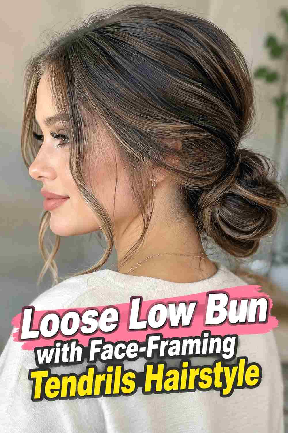 2. Loose Low Bun With Face Framing Tendrils Hairstyle