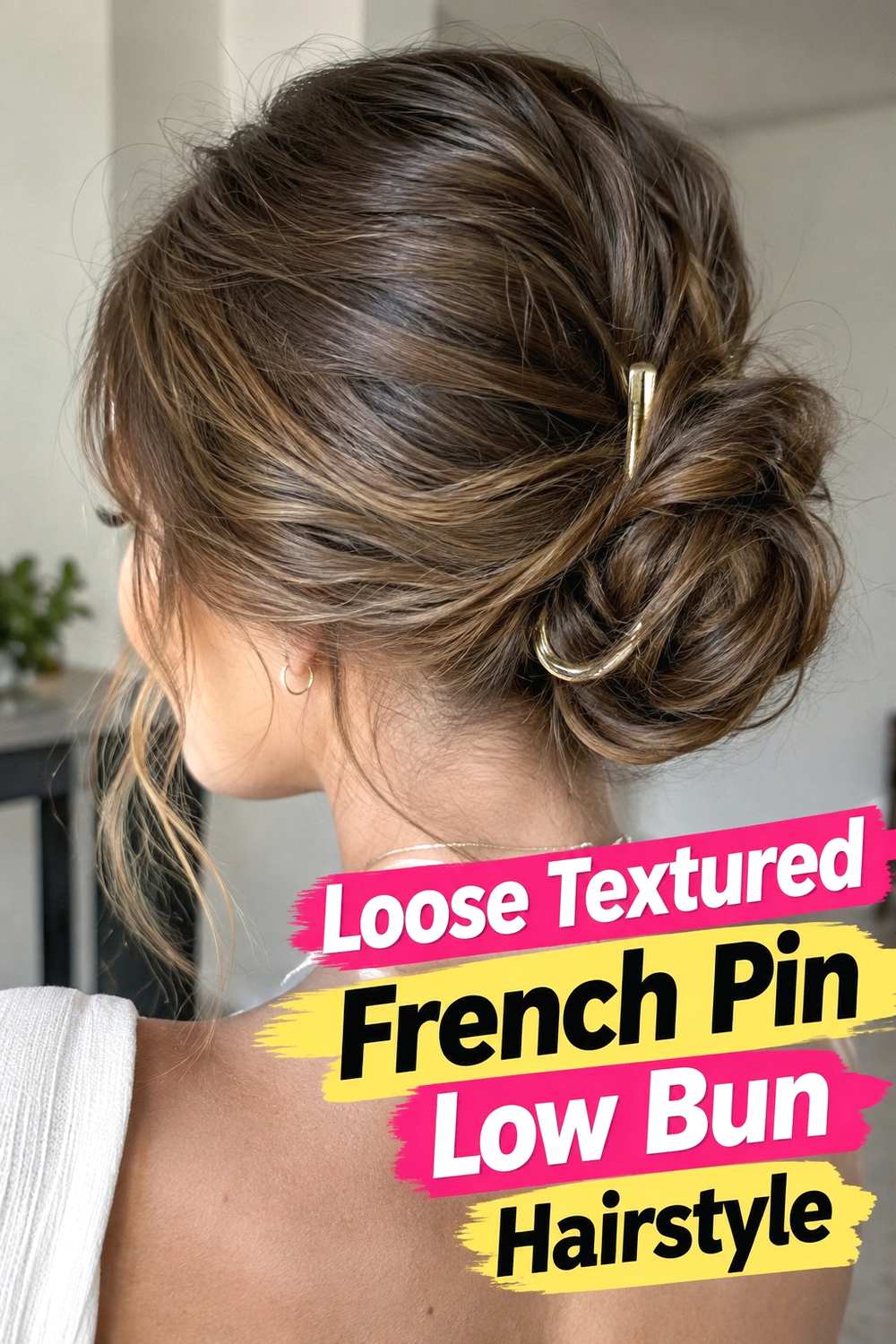 4. Loose Textured French Pin Low Bun Hairstyle