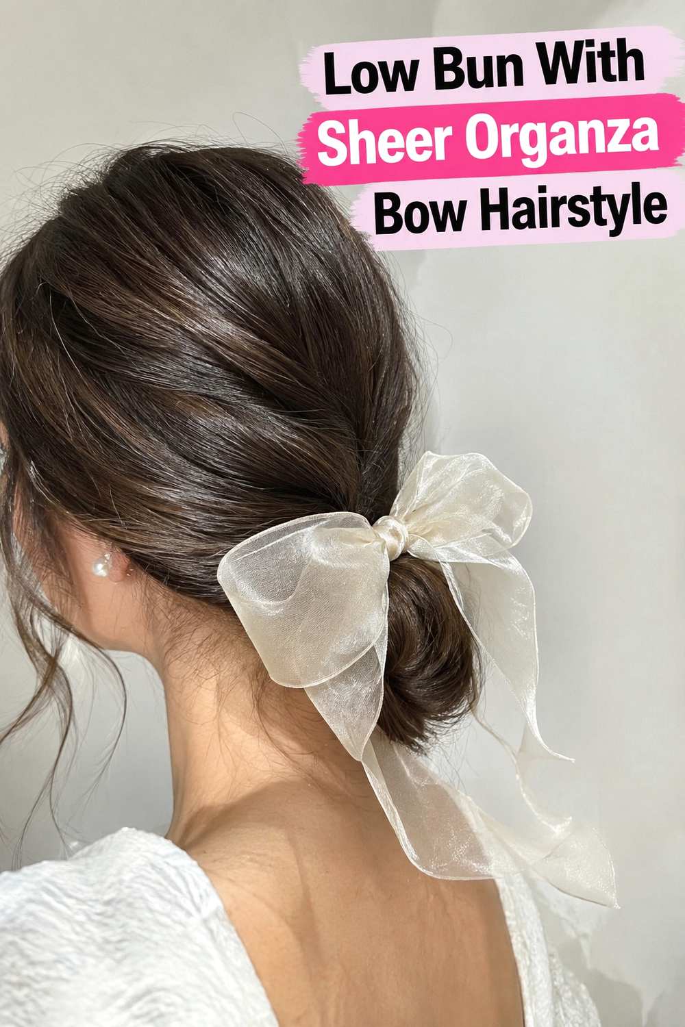 5. Low Bun With Sheer Organza Bow Hairstyle