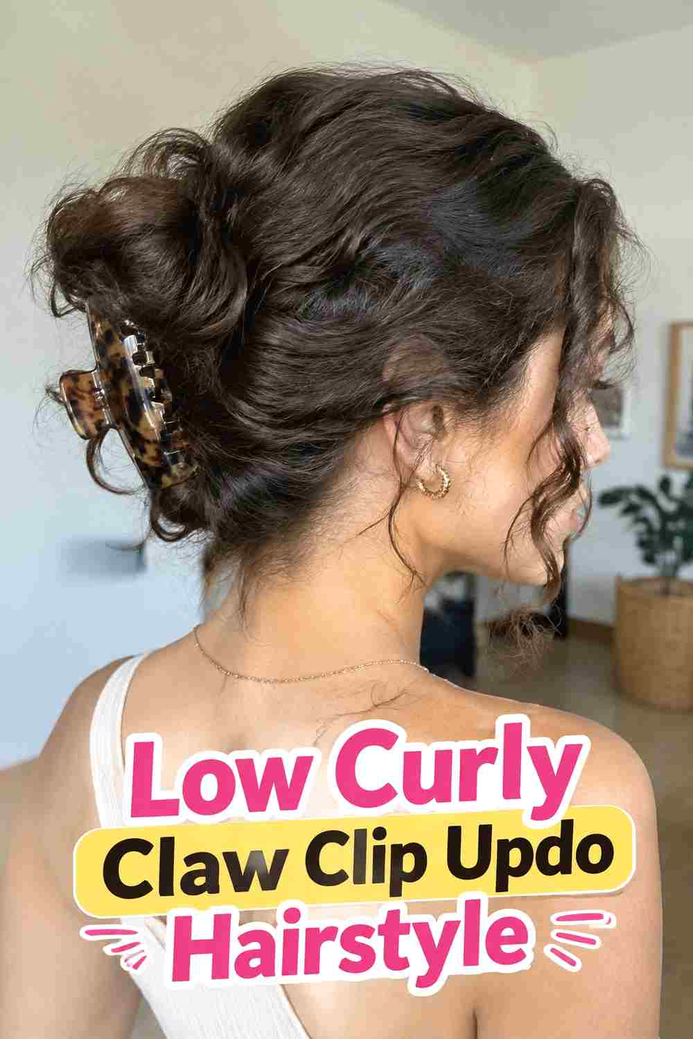 3. Low Curly Claw Clip Updo Hairstyle