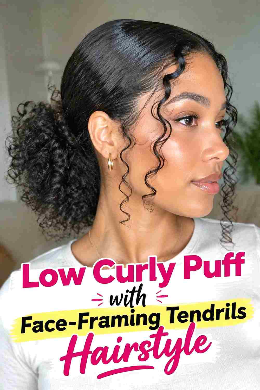 7. Low Curly Puff With Face Framing Tendrils Hairstyle
