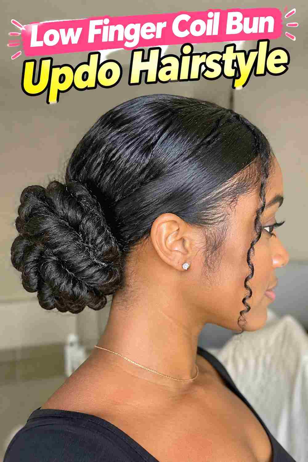 2. Low Finger Coil Bun Updo Hairstyle