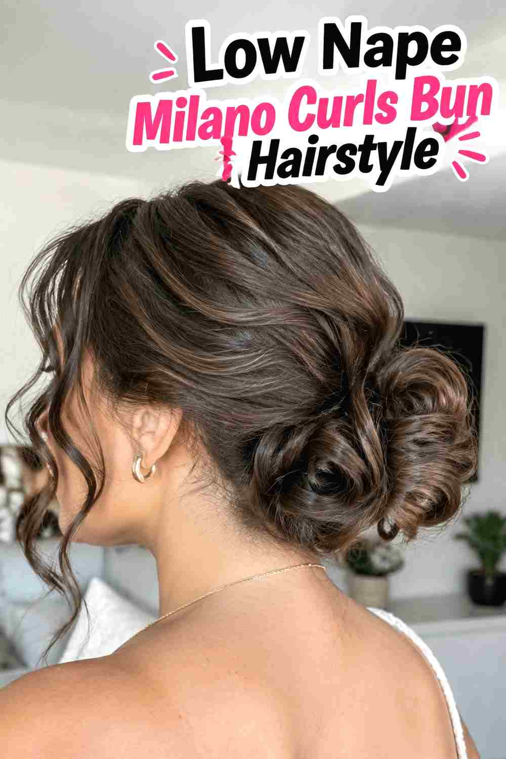 2. Low Nape Milano Curls Bun Hairstyle
