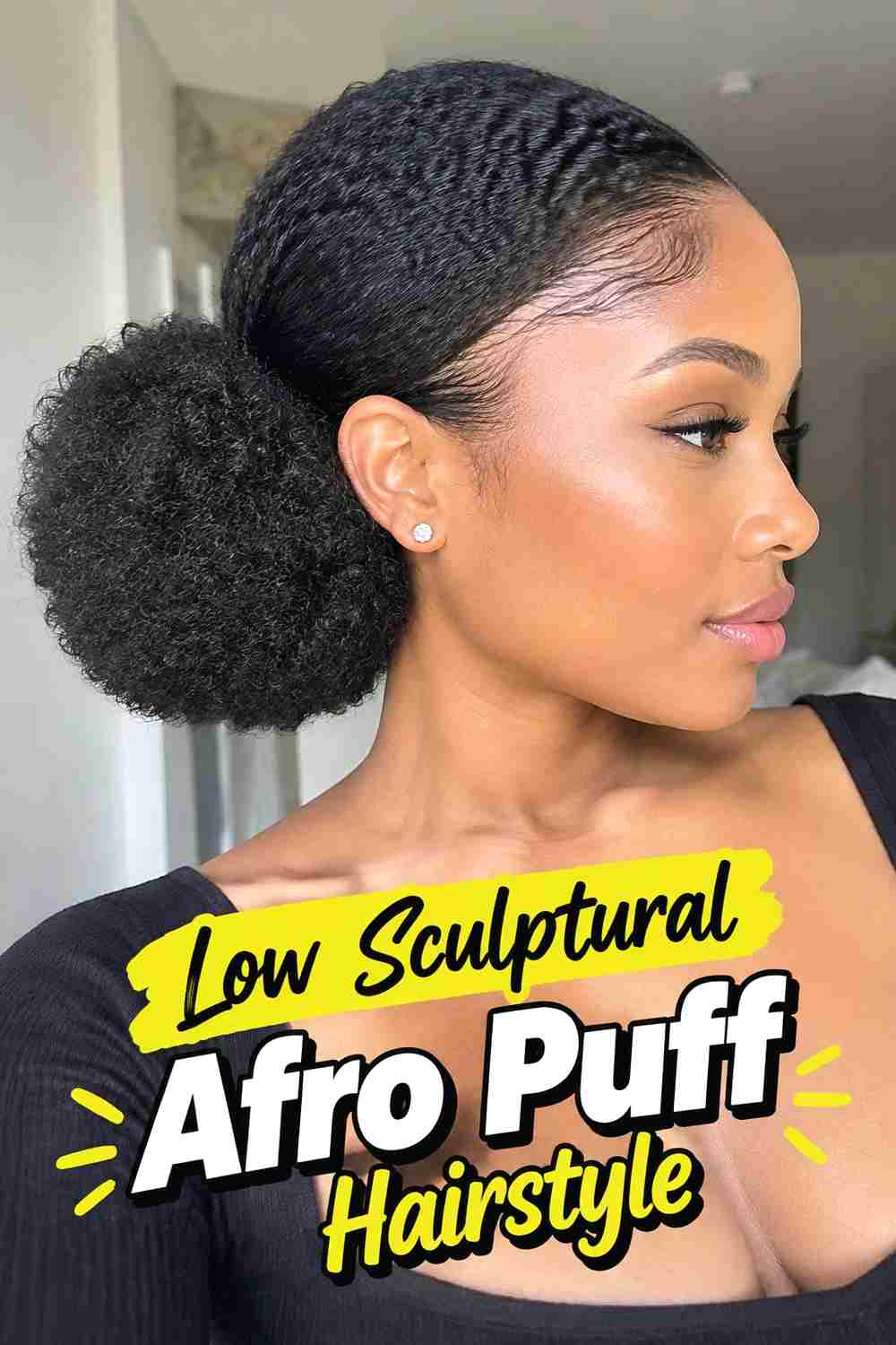 13. Low Sculptural Afro Puff Hairstyle