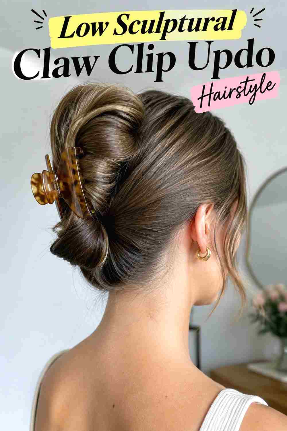 7. Low Sculptural Claw Clip Updo Hairstyle