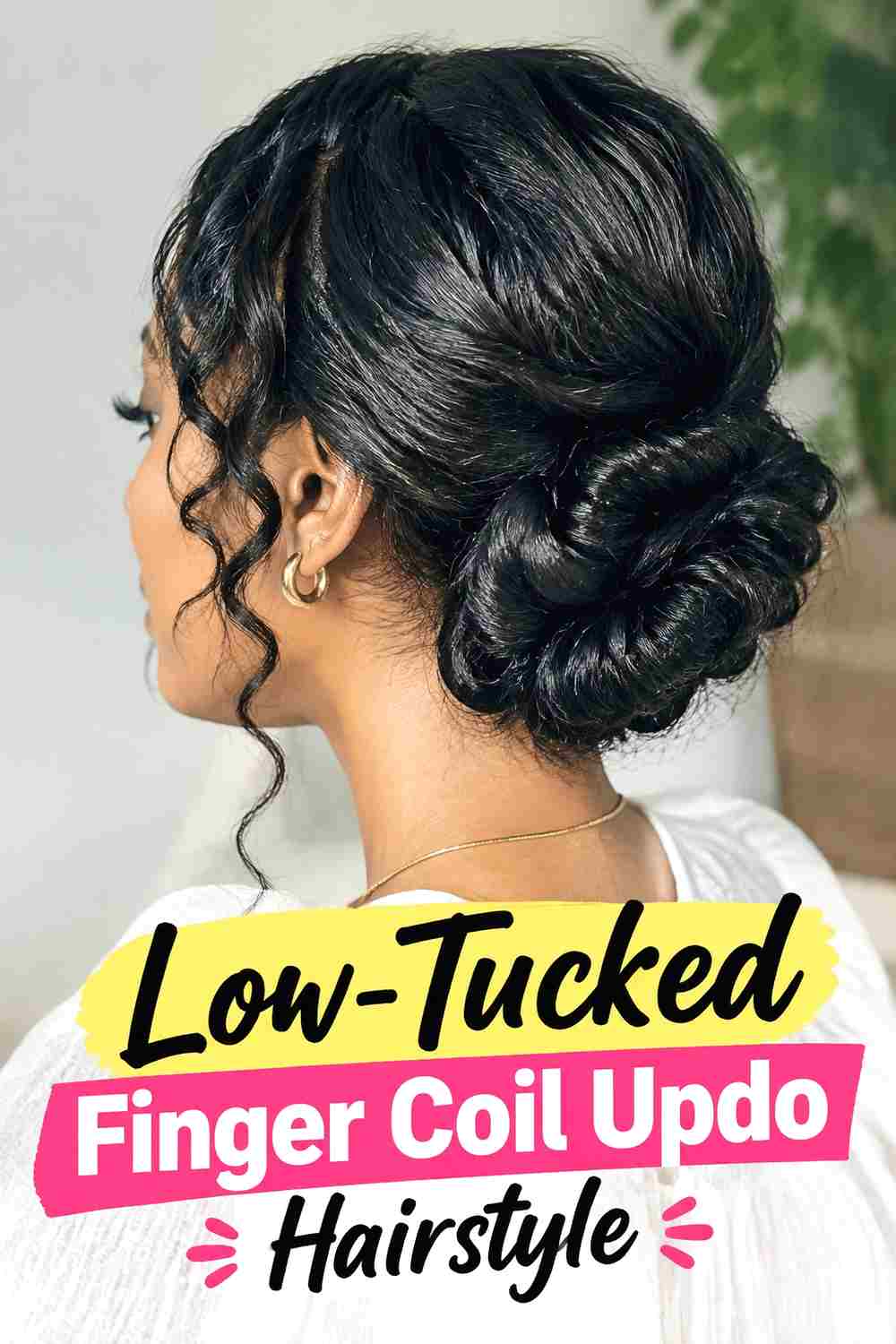 19. Low Tucked Finger Coil Updo Hairstyle