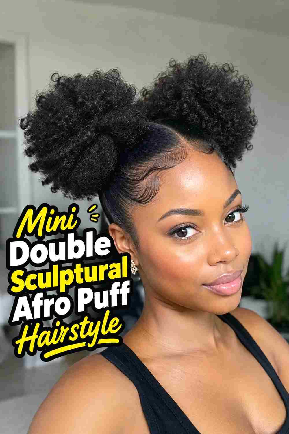 14. Mini Double Sculptural Afro Puff Hairstyle