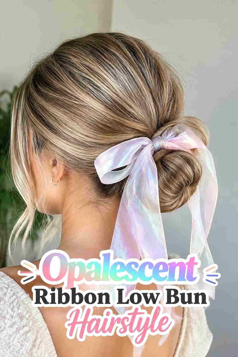 9. Opalescent Ribbon Low Bun Hairstyle