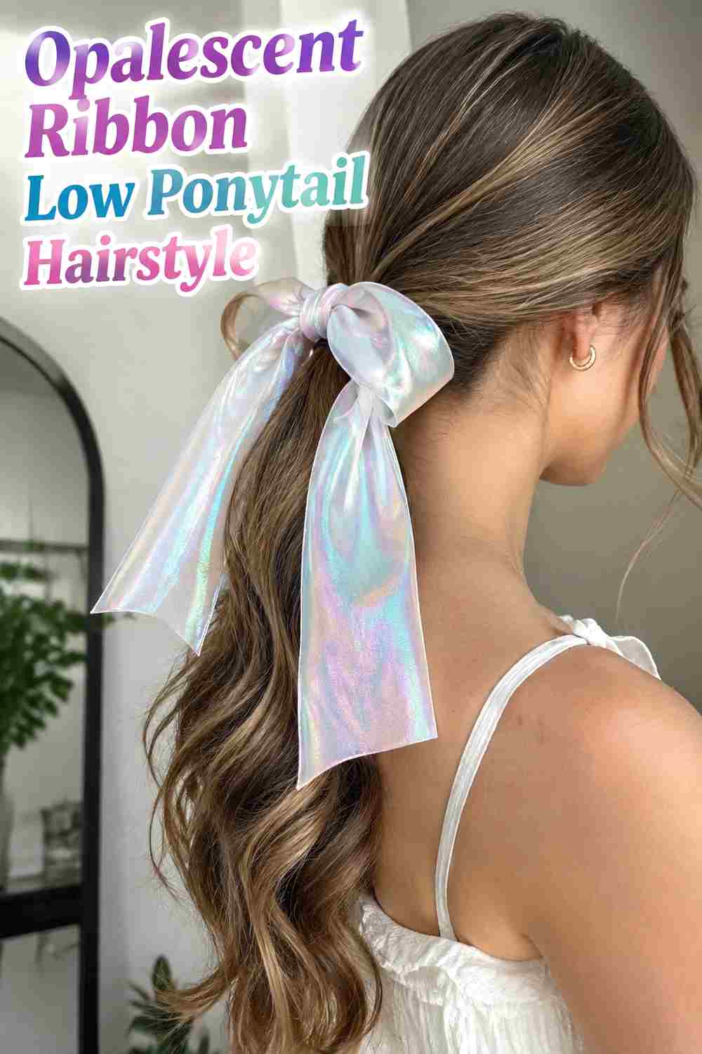 2. Opalescent Ribbon Low Ponytail Hairstyle