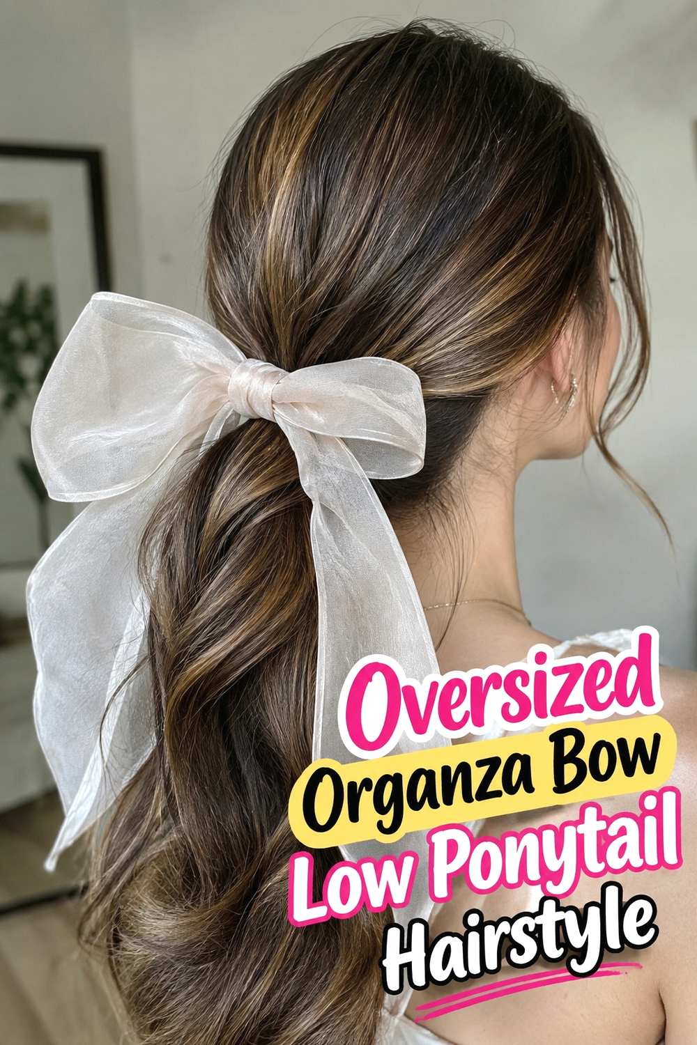 1. Oversized Organza Bow Low Ponytail Hairstyle