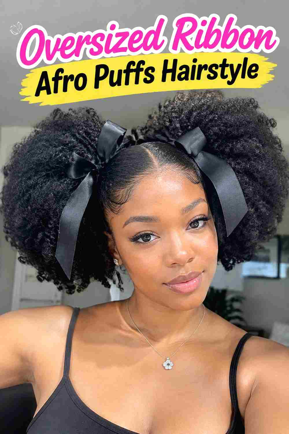 6. Oversized Ribbon Afro Puffs Hairstyle