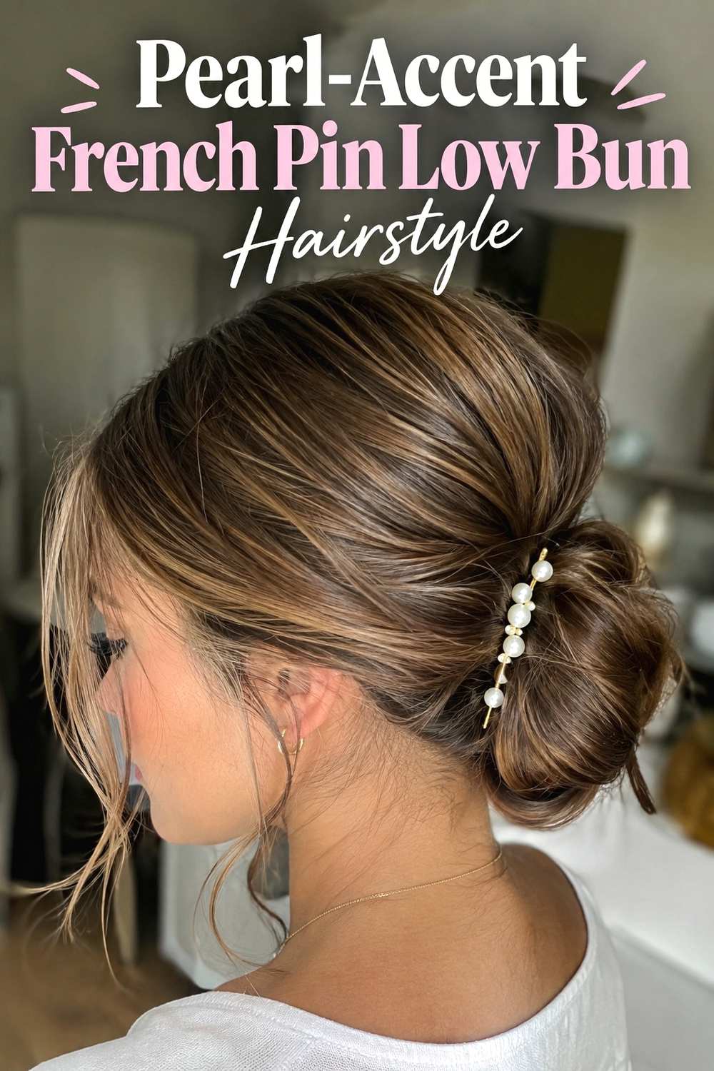 15. Pearl Accent French Pin Low Bun Hairstyle