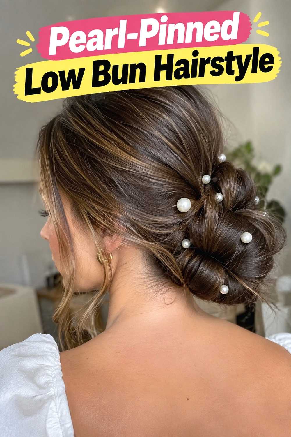 7. Pearl Pinned Low Bun Hairstyle